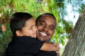 Young African American Dad Being Hugged By Son Royalty Free Stock Photo