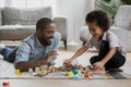 Young african American dad and little son playing at home Royalty Free Stock Photo
