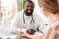 Young African-American doctor checking patient`s Royalty Free Stock Photo