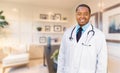 Young African American Doctor or Nurse Standing in His Office Royalty Free Stock Photo