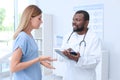 Young African-American doctor speaking with his patient Royalty Free Stock Photo