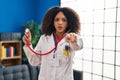 Young african american doctor woman wearing doctor uniform and stethoscope pointing with finger to the camera and to you, Royalty Free Stock Photo