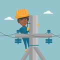 African electrician working on electric power pole