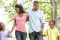 Young African American Family Enjoying Walk In Park Royalty Free Stock Photo