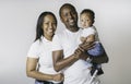 Young African American family in the studio with baby toddler son Royalty Free Stock Photo