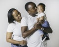 Young African American family in the studio with baby toddler son Royalty Free Stock Photo