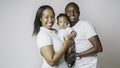 Young African American family in the studio with baby toddler son Royalty Free Stock Photo