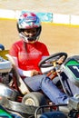 Young African American female with a helmet at a -karting race