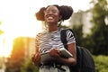 Young African American female student, with a backpack and laptop outdoors Royalty Free Stock Photo