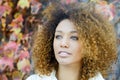 Young African American girl with afro hairstyle and green eyes Royalty Free Stock Photo