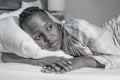 Young African American girl at night suffering depression and insomnia - attractive sad and depressed black woman lying thoughtful Royalty Free Stock Photo