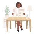 Young African American girl sitting at a table and reading a newspaper, black woman reads press or magazine. Home furnishings and