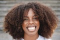 Young african american girl smiling on camera outdoor in the city - Focus on face Royalty Free Stock Photo