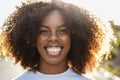 Young african american girl smiling on camera outdoor in the city - Focus on face Royalty Free Stock Photo