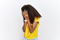 Young african american girl standing over white isolated background with sad expression covering face with hands while crying Royalty Free Stock Photo