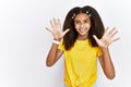 Young african american girl standing over white isolated background showing and pointing up with fingers number ten while smiling Royalty Free Stock Photo