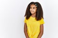 Young african american girl standing over white isolated background smiling looking to the side and staring away thinking Royalty Free Stock Photo