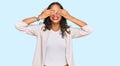 Young african american girl wearing business clothes covering eyes with hands smiling cheerful and funny Royalty Free Stock Photo