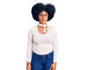 Young african american girl wearing casual clothes and glasses relaxed with serious expression on face Royalty Free Stock Photo