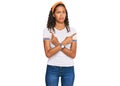 Young african american girl wearing casual clothes pointing to both sides with fingers, different direction disagree