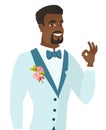 Young african-american groom showing ok sign.