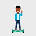 Young African American on hoverboard smiling and waving. Riding gyro scooter. Commuting concept. Royalty Free Stock Photo