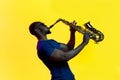 Young african-american jazz musician playing the saxophone Royalty Free Stock Photo