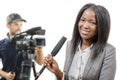 Young African american journalist with a microphone and a camera Royalty Free Stock Photo