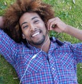 Young african american male lying in grass Royalty Free Stock Photo