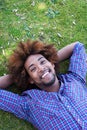 Young african american male lying in grass Royalty Free Stock Photo