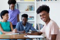 Young african american male student learning at desk at school Royalty Free Stock Photo