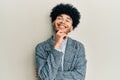 Young african american man with afro hair wearing casual clothes  glasses smiling looking confident at the camera with crossed Royalty Free Stock Photo