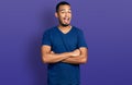 Young african american man with arms crossed gesture smiling and laughing hard out loud because funny crazy joke Royalty Free Stock Photo