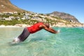 Young african american man diving into sea