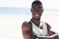 Young African American man enjoys the sun at the beach Royalty Free Stock Photo