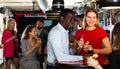 Young african american man flirting with girl on party