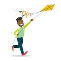 Young african-american man flying a kite. Royalty Free Stock Photo