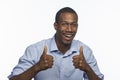 Young African American man giving thumbs up, horizontal