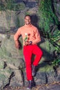 Young African American Man holding white flower, waiting for you Royalty Free Stock Photo