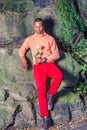 Young African American Man holding white flower, waiting for you Royalty Free Stock Photo