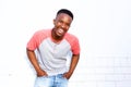 Young african american man laughing against white wall Royalty Free Stock Photo