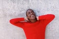 Young african american man laughing with hands behind head Royalty Free Stock Photo
