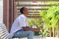 Young african american man laughing with mobile phone Royalty Free Stock Photo