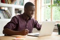 Young african-american man looking at laptop frustrated by bad n Royalty Free Stock Photo