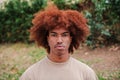 Young african american man looking serious at camera. Close up portrait of teenage male with pensive attitude. front Royalty Free Stock Photo