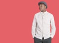 Young African American man looking sideways over red background Royalty Free Stock Photo