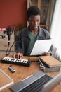 Young African-American Man Making Music at Home Royalty Free Stock Photo