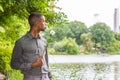 Young African American Man missing you and waiting for you at Central Park in New York Royalty Free Stock Photo