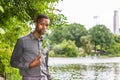 Young African American Man missing you and waiting for you at Central Park in New York Royalty Free Stock Photo