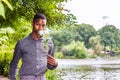Young African American Man missing you and waiting for you at Central Park in New York Royalty Free Stock Photo